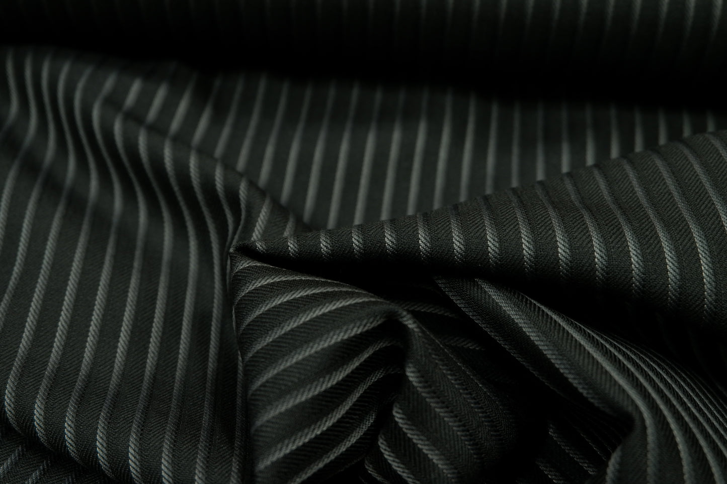 Raymond Greenish Black Self Stripes Poly Wool Fabric